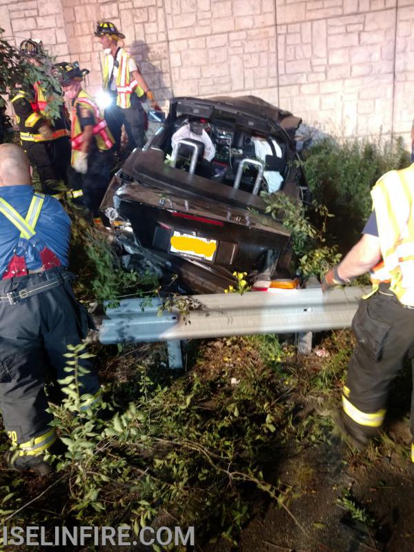 Car hit the bridge abutment and knocked down a tree at the Route 1&9 Split, August 21, 2020.